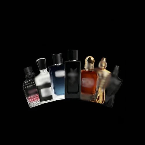 Set of assorted fragrance bottles from Theplugcrew Ultimate Fragrance Bundle, featuring diverse scents in sleek packaging.