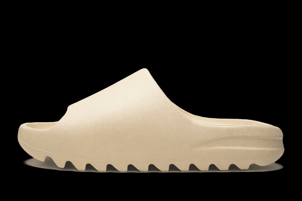 Reselling Vendor Zeezy slides in black, featuring wide straps and comfortable sole, suitable for casual wear and lounging.