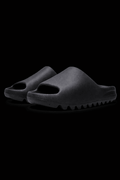 Pair of Zeezy Slides from Reselling Vendor, featuring comfortable slip-on design and casual style, shown on a clean background.